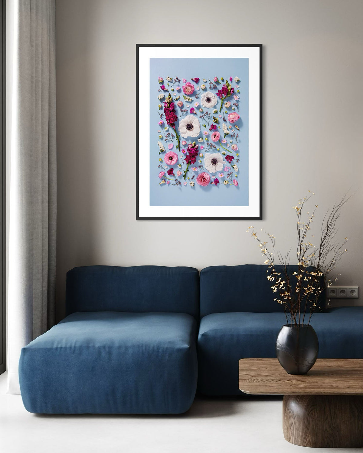 Confident Calm - fine art floral flatlay of anemones, snapdragons and ranunculus on pale blue on a living room wall, from Quiet Emergence by Connie Chan.
