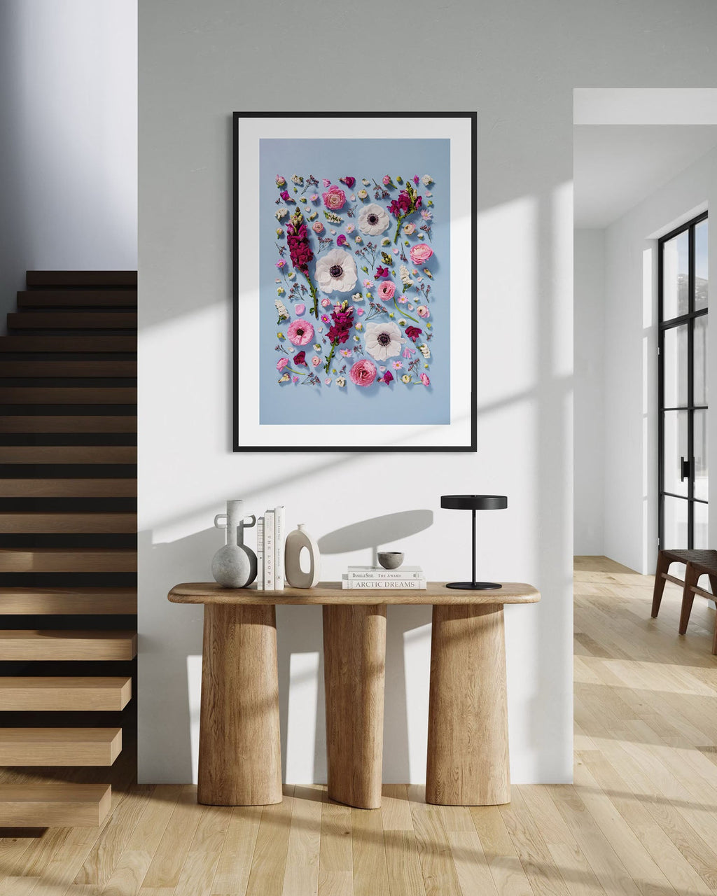 Confident Calm - fine art floral flatlay of anemones, snapdragons and ranunculus on pale blue on a hallway wall, from Quiet Emergence by Connie Chan.

