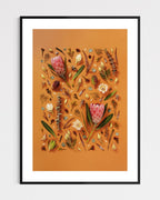 Enduring Stillness - fine art floral flatlay of proteas and eucalyptus on warm terracotta in a black frame, from Quiet Emergence by Connie Chan.