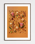 Enduring Stillness - fine art floral flatlay of proteas and eucalyptus on warm terracotta in a dark wood frame, from Quiet Emergence by Connie Chan.
