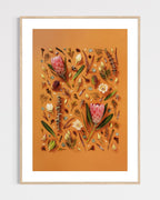 Enduring Stillness - fine art floral flatlay of proteas and eucalyptus on warm terracotta in a light wood frame, from Quiet Emergence by Connie Chan.