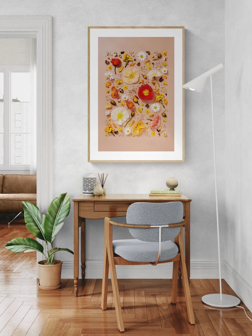 Joy and Lightness - fine art floral flatlay of Iceland poppies and daisies on warm peach on a wall above a desk, from Quiet Emergence by Connie Chan.
